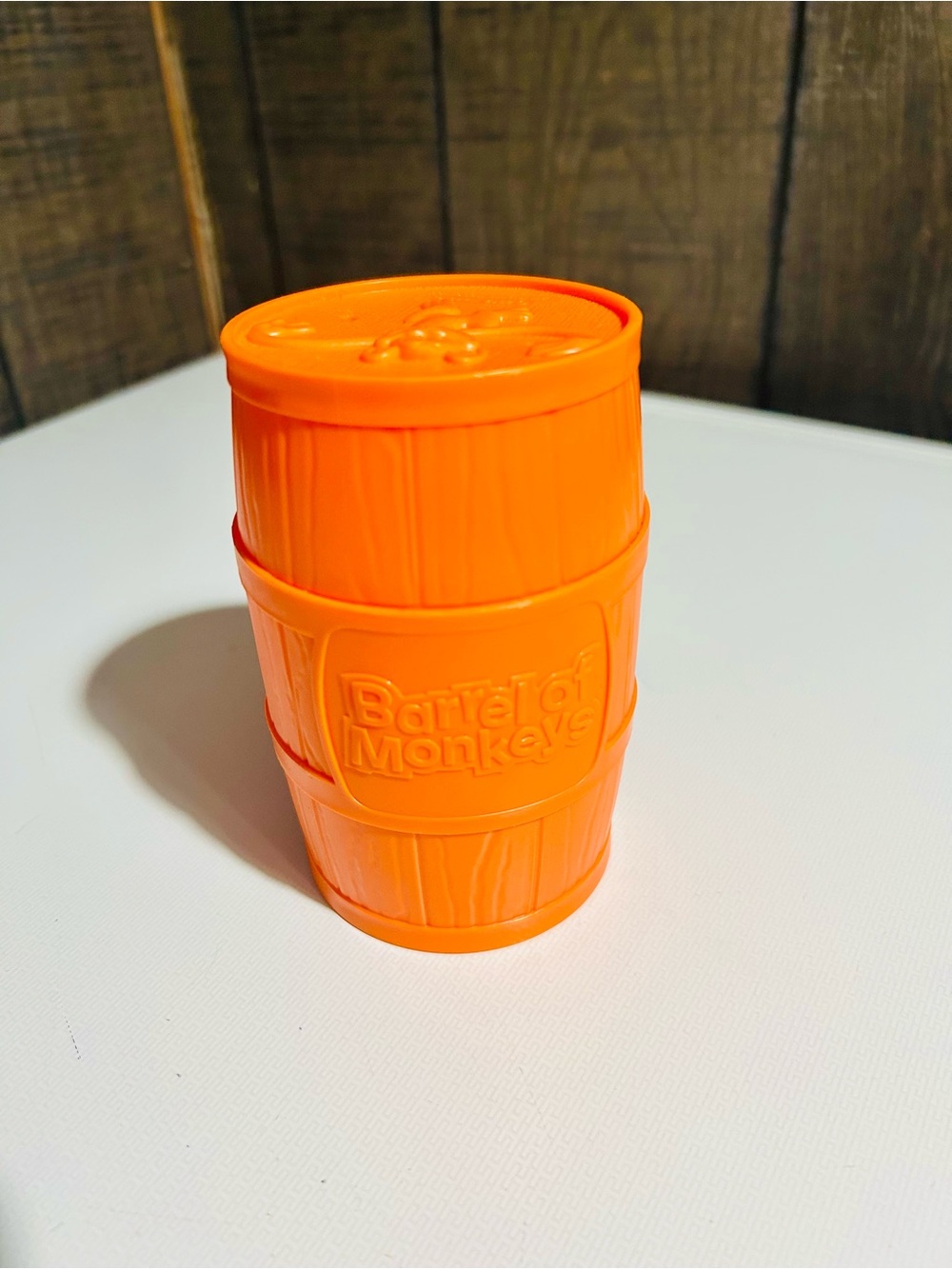 (3/$10) orange Barrel of Monkeys toy